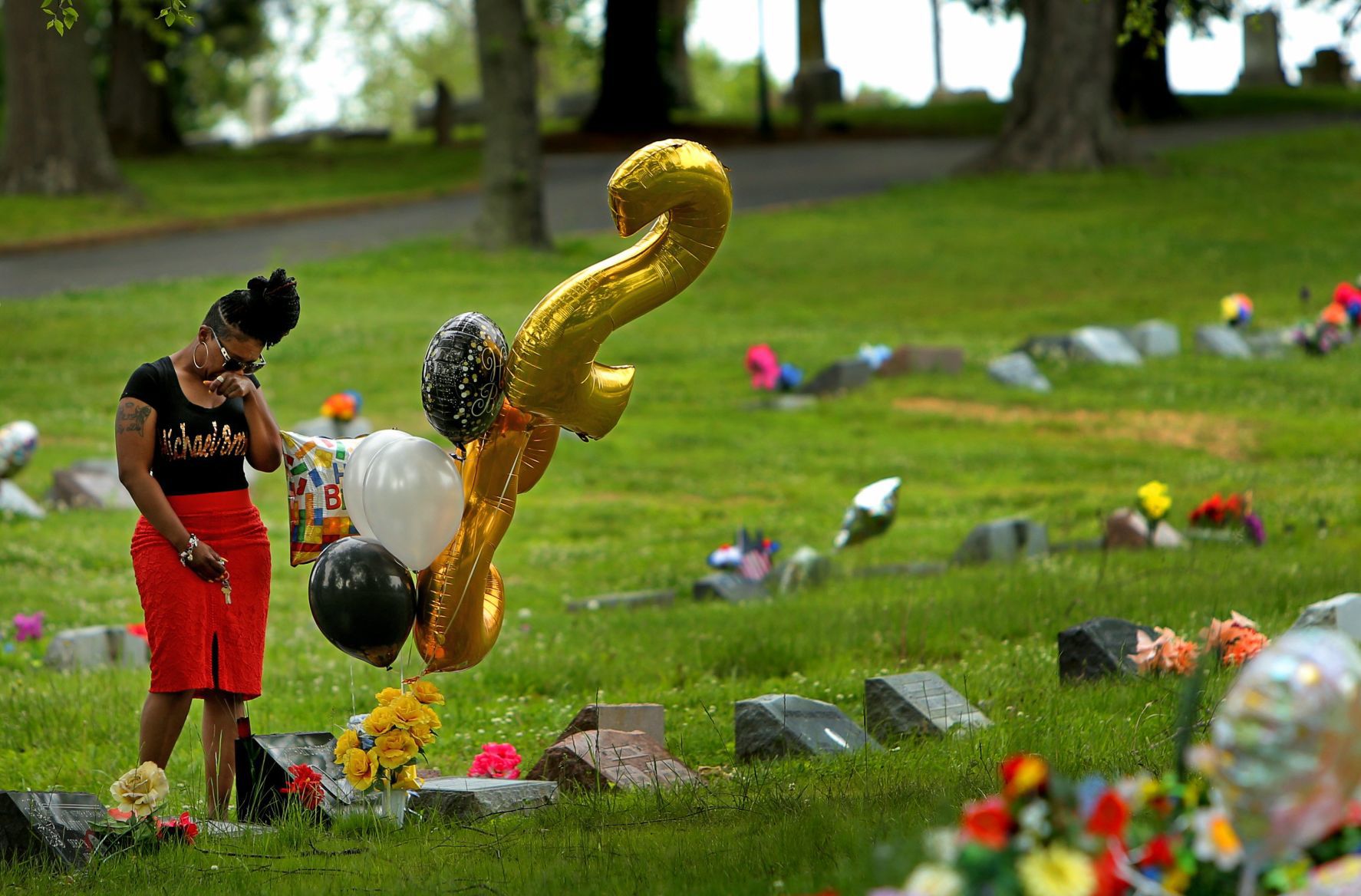 Lesley McSpadden visits her son's grave